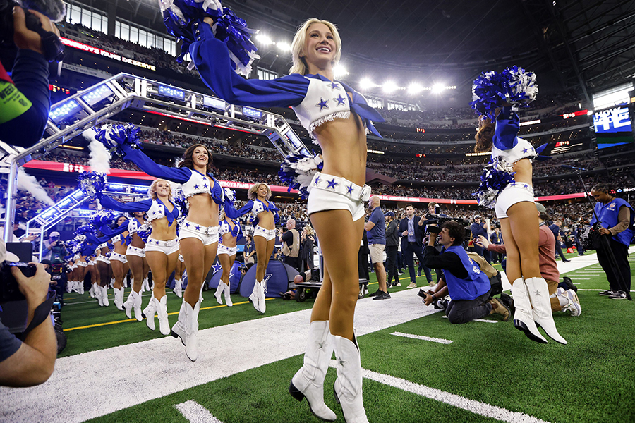 The Dallas Cowboys Cheerleaders skip onto the field during their introduction before a game against the Washington Commanders at AT&amp;T Stadium in Arlington, Texas, on Nov. 23, 2023. (Tom Fox / The Dallas Morning News / Tribune News Service)