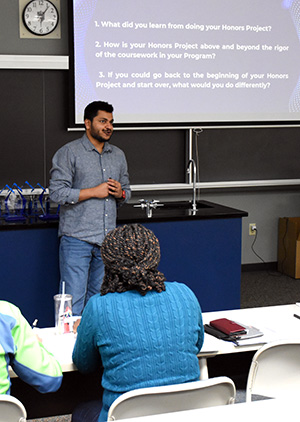 Balaji “Abi” Abishek answers questions during his honors presentation in December.