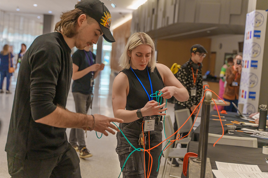 Carson Huessner, left, and Mackenzie Smith compete in the Tech Olympics during the Kennedy Center American College Theater Festival at Madison College in January.