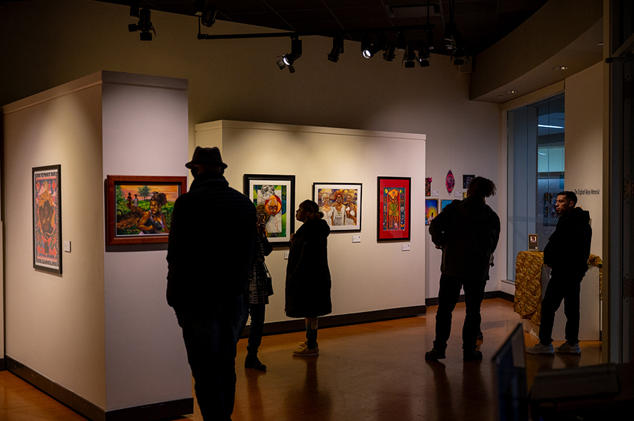 Truax Gallery visitors enjoy the “SOULful Joy” art exhibit prior to its opening celebration that was held on Feb. 6. The exhibit honors long-time advisor Dzigbodi Akyea.