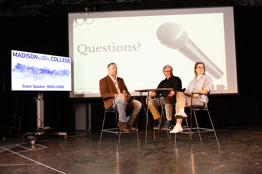 Video journalist Brad Horn, left, answers questions from moderators instructor L. David Hansen, center, and creative arts intern Olivia Petersen during a Writer’s Life Lecture Series event on Feb. 25. 