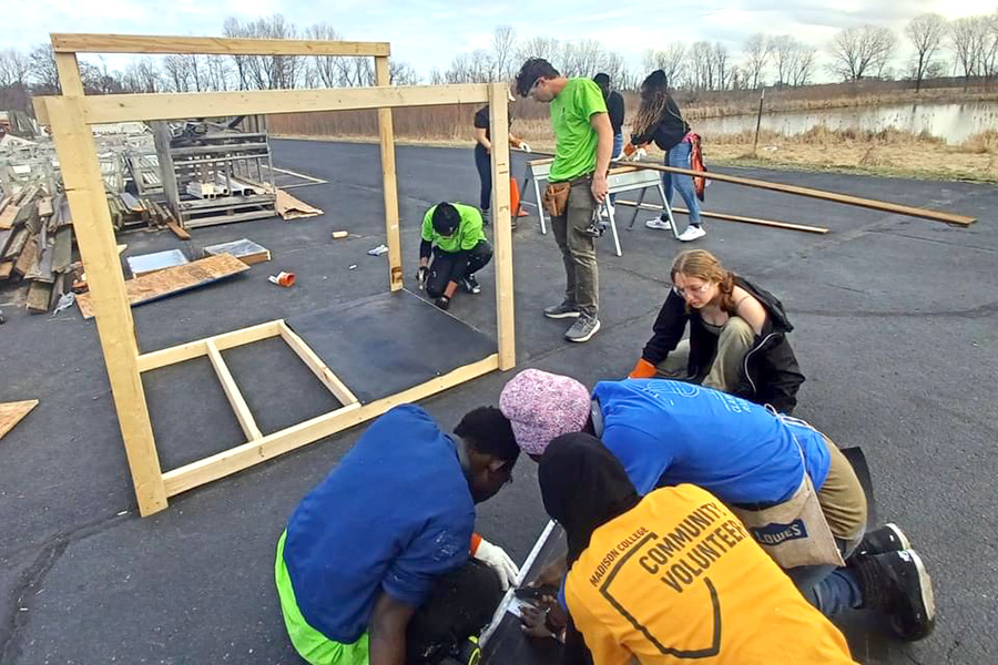 Students work on a construction project during the 2024 alternative spring break trip.